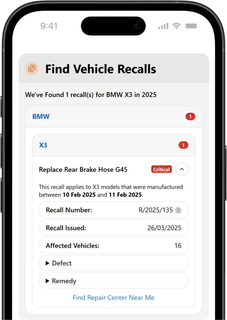 Smartphone showing a vehicle recall check tool on screen.